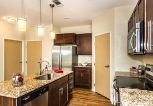 Open concept living and dining for residents of The Gardens Apartments. 