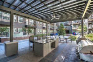 The pool plaza at Olympus at Ross provides a great place for grilling and entertaining.